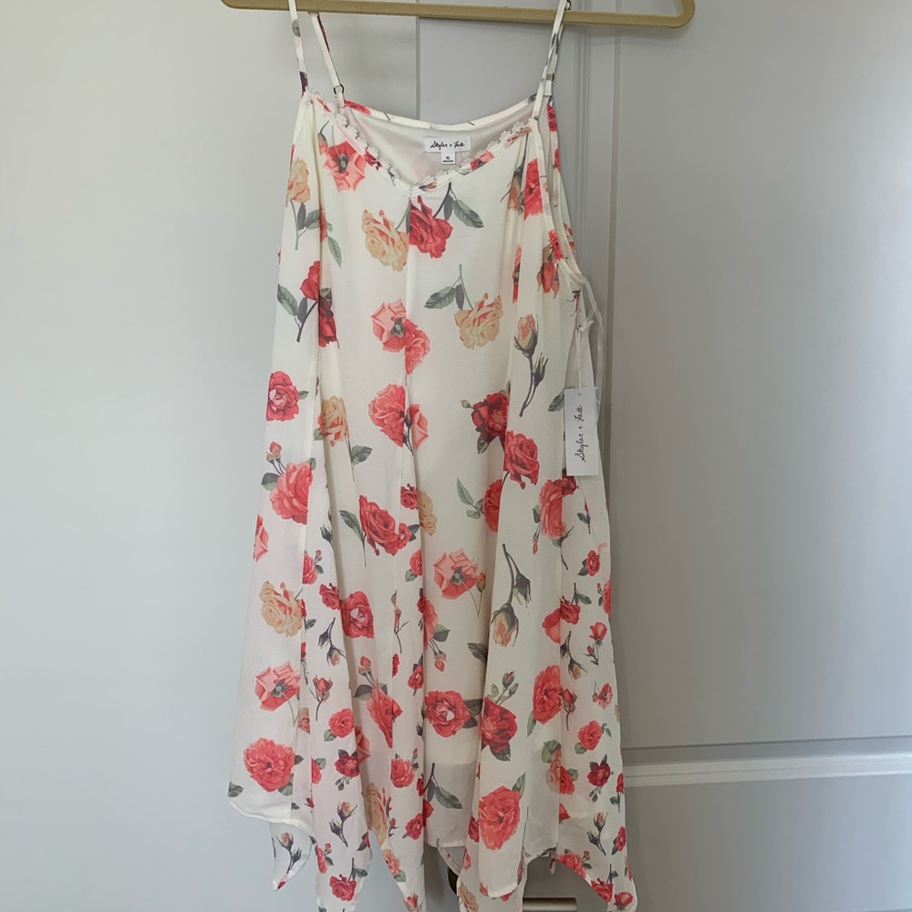 White dress with lace detailing and flowers